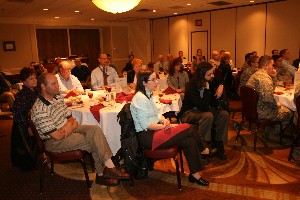 Attendees at the October luncheon listen to Kirk's presentation on Cox Communications.